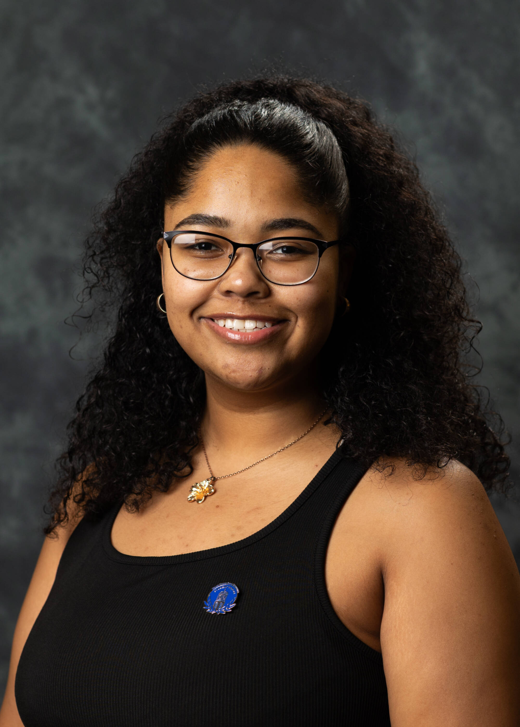 Arianna Westbrooks smiling in a black top